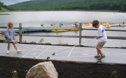 Kids Playing Shuffleboard at the Lake